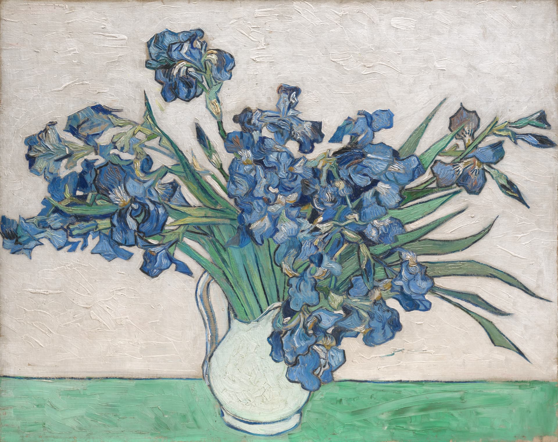 Painting of blue irises in a white jug against a pale, textured ground, built from visible gestural brushstrokes of blue, green and white.